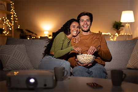 Couple watching TV in Home Cinema 